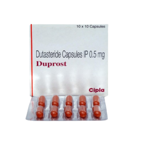 The image shows a box of Duprost, which contains Dutasteride Capsules IP 0.5 mg. The packaging is white with the Cipla brand logo in red at the bottom right. In front of the box is a silver blister pack containing ten reddish-orange capsules. The top of the box indicates a quantity of 10 x 10 Capsules.