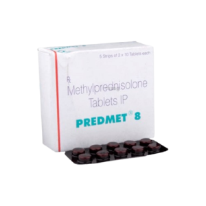 The image shows a box of Predmet 8, which contains Methylprednisolone Tablets IP.Beside the white and red rectangular box is a dark-colored blister pack containing several round, reddish-brown tablets. The box indicates it contains 5 strips of $2 \times 10$ tablets each.
