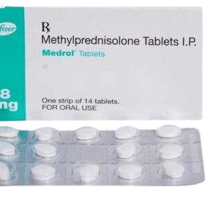 The image shows a box of Medrol Tablets, which contain Methylprednisolone Tablets I.P. The white packaging features a teal vertical band on the left with the Pfizer logo. Below the box is a clear blister pack containing oval-shaped white tablets. The label states the package contains one strip of 14 tablets for oral use.