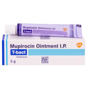 A product shot showing a purple and white tube of T-bact ointment resting on its corresponding white rectangular box. The text on both the tube and the box identifies the medication as Mupirocin Ointment I.P., manufactured by GSK. The packaging features blue horizontal lines, a QR code, and indicates a net weight of 5 g.