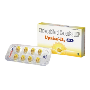A product box and blister pack for Uprise-D3, which contains Cholecalciferol Capsules USP 60K (Vitamin D3). The box is white and yellow with a sun graphic, while the foreground shows a silver foil blister strip containing eight translucent yellow softgel capsules. The packaging includes the brand name in orange and the manufacturer logo, "Alkem," in the bottom corner.